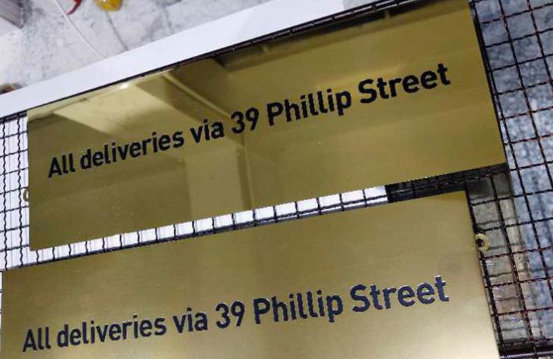 all-deliveries-engraved-and-paint-filled-brass-engraved-sign