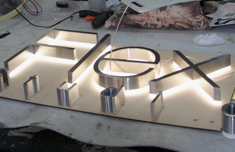 fabricated-stainless-steel-with-acrylic-glowing-behind
