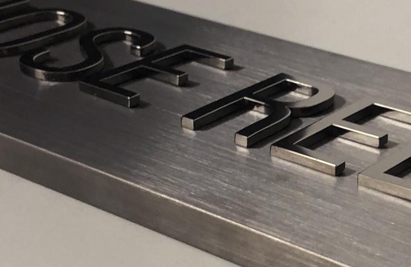 close-up-brushed-and-mirror-polished-titanium-sign