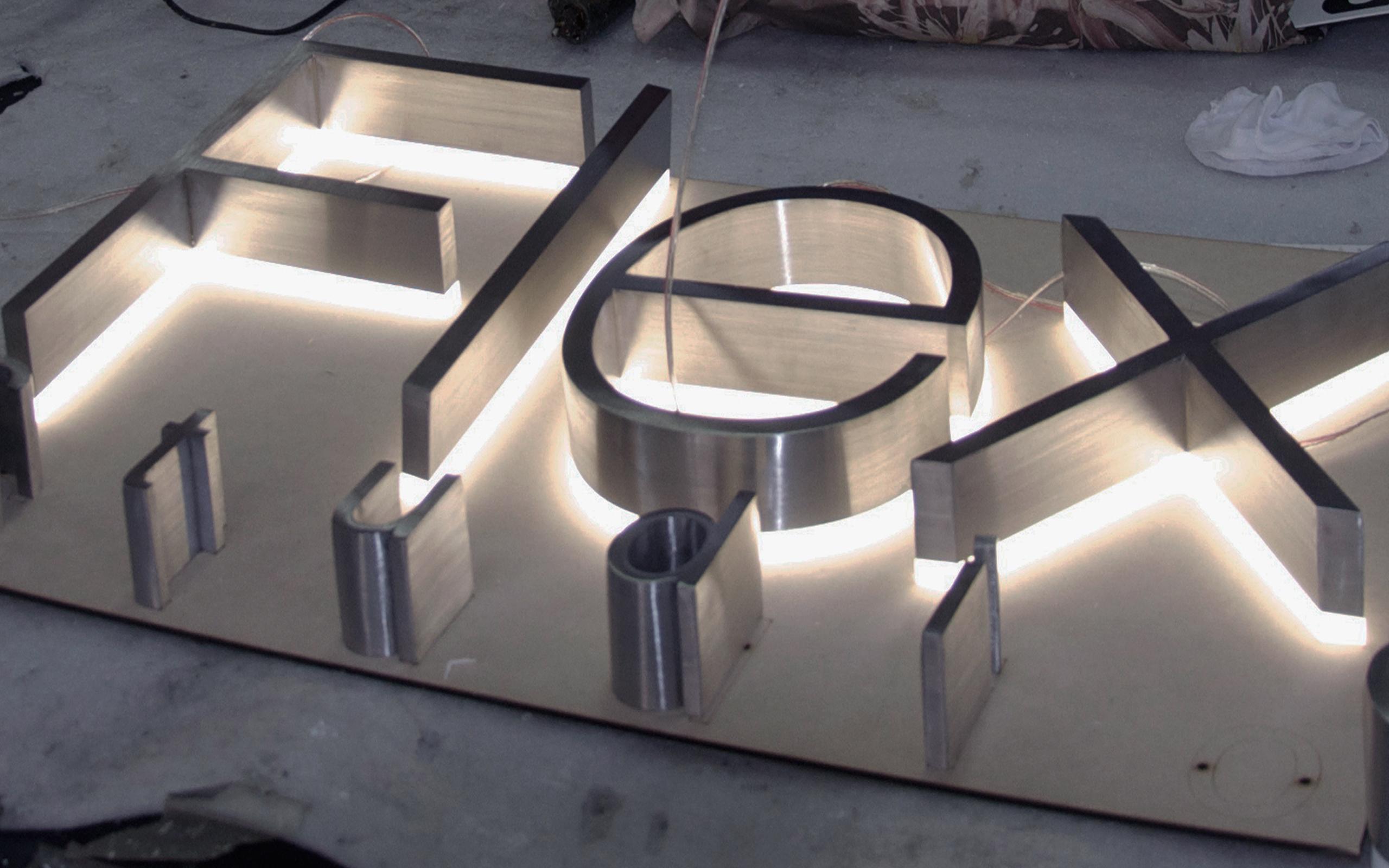thick-fabricated-stainless-steel-signage-with-back-lit-illumination