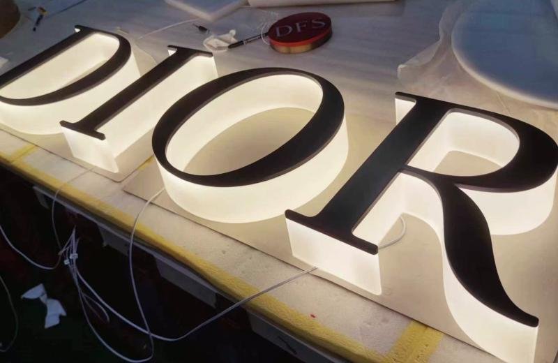 Dior letters with an extreme thick acrylic backing illuminated sign