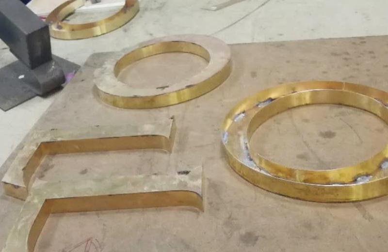 Brass-fabricated-signs-in-early-stages-of-production