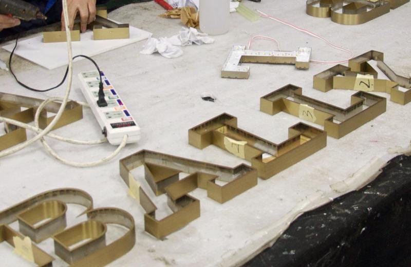 bally-brass-signage-in-production