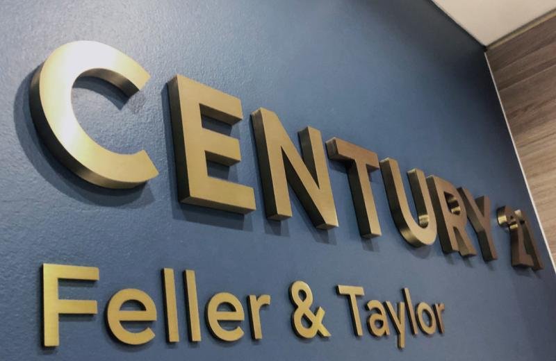 century21-logo-fabricated-in-brushed-brass