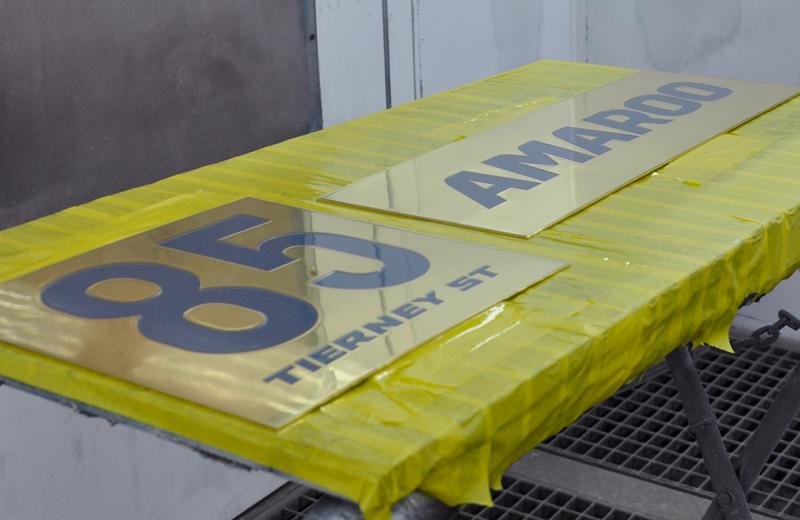 engraved-sign-clear-coat-drying-out-in-booth