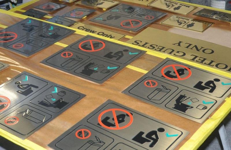 engraved-signs-being-clear-coated