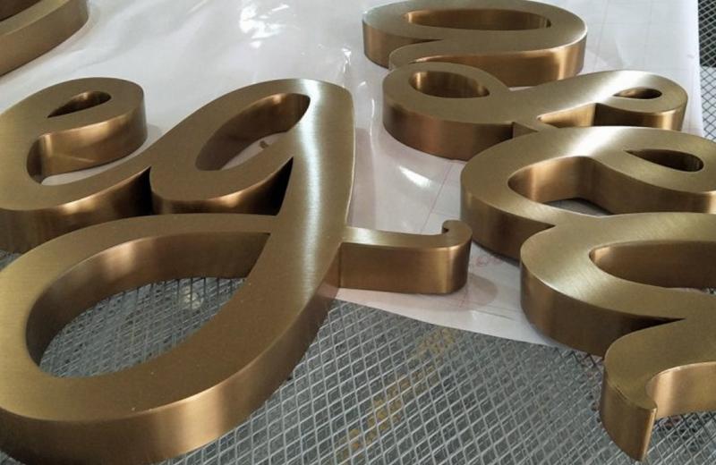fabricated-brass-signs-with-a-brushed-finish