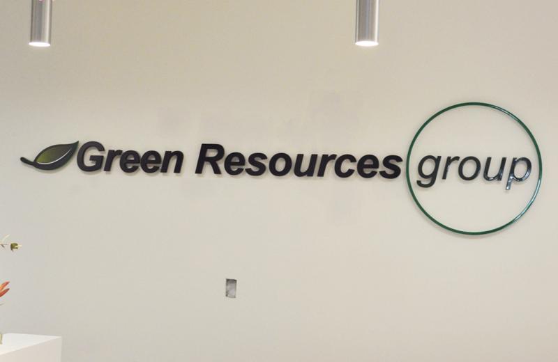 green-logo-sign-installed-front-on-photo
