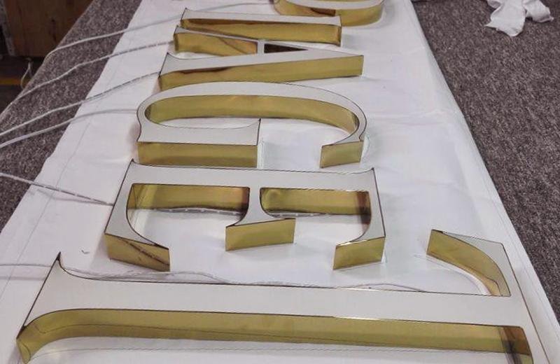 rimless-illuminated-brass-signage-logo-sign