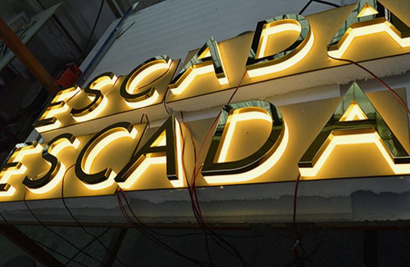 strong-back-lighting-signage-glowing-brass-polished-letters