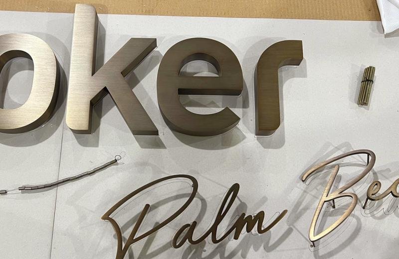 aged-brass-detailed-logo-close-up-lj-on-table