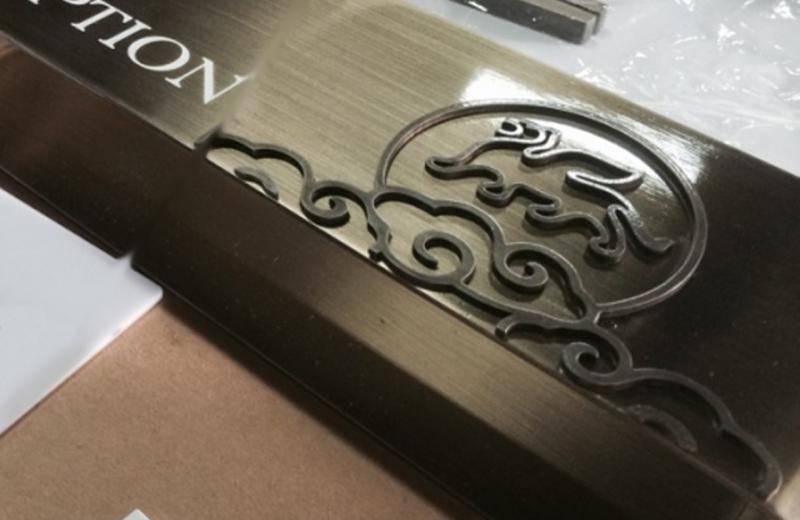 aged-brass-detailed-logo-close-up