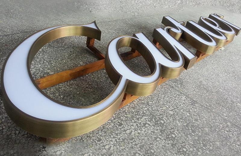 aged-brass-detailed-logo-fabricated