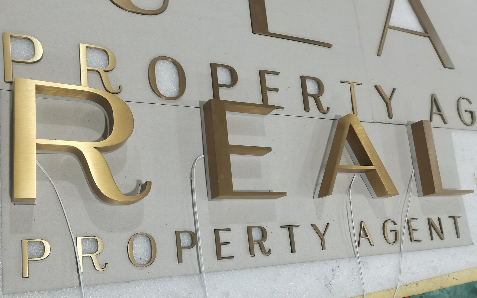brass-metal-signage-solid-and-fabricated-metal-with-a-brushed-finish