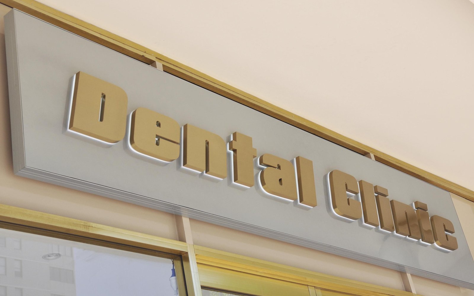 dental-clinic-fabricated-brass-with-illumination-in-frame